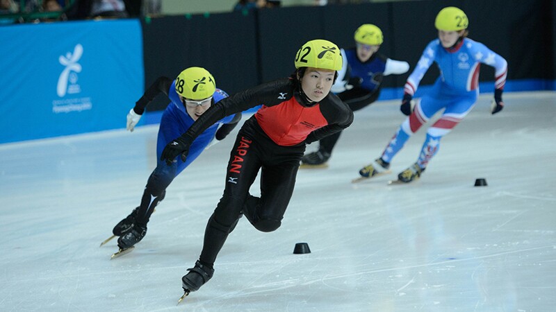 Short Track Speed Skaters racing on the ice in Pyeong Chang Korea. 