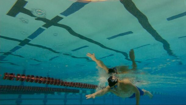 Jonny Pierce swimming underwater. 