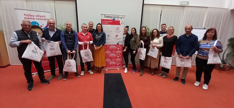 Special Olympics Programs, SOEE and Centre for Sports and Human Rights representatives gathered in a room posing for the photo