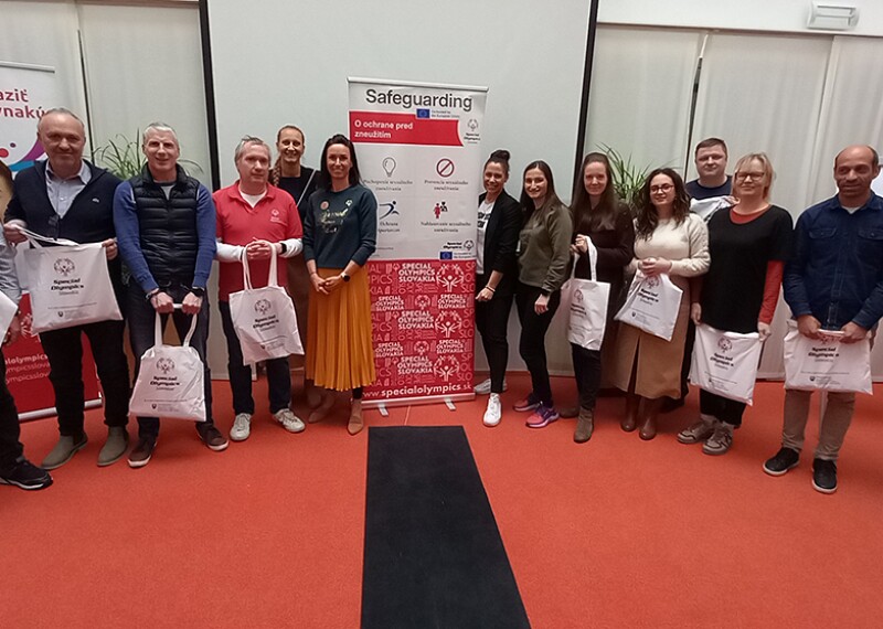 Special Olympics Programs, SOEE and Centre for Sports and Human Rights representatives gathered in a room posing for the photo