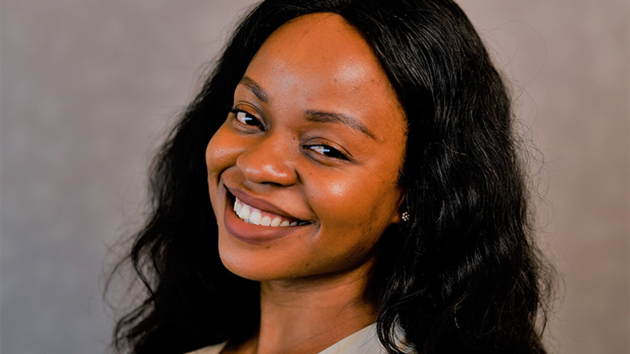 Headshot of Tanya smiling at camera