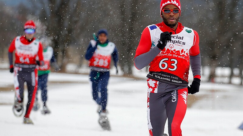 Snowshoe athletes performing in the snow. 