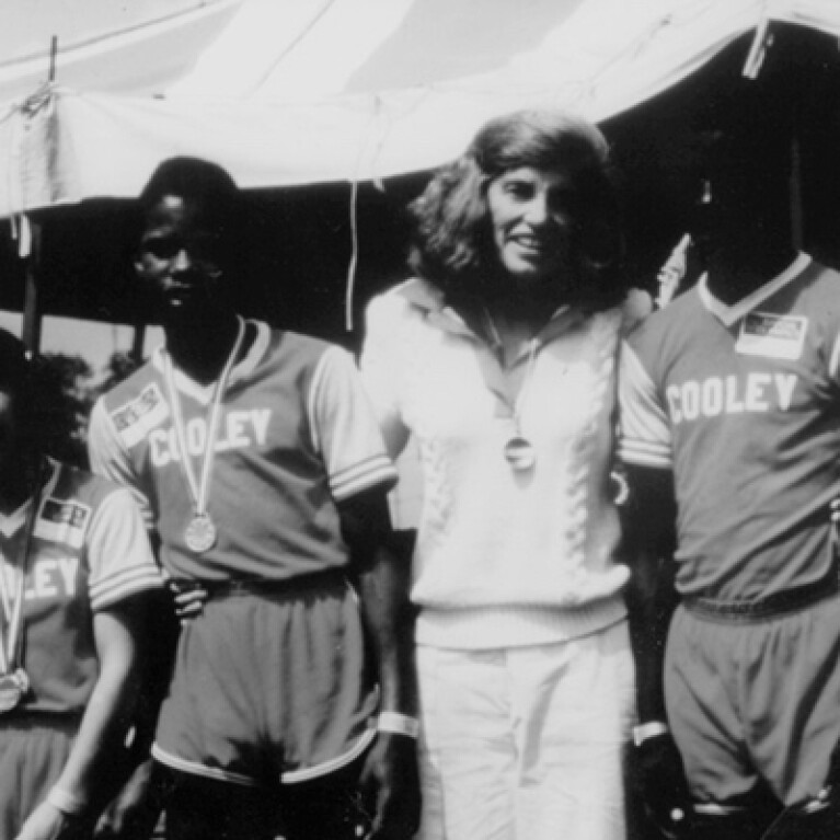 Eunice Kennedy Shriver standing with athletes. 