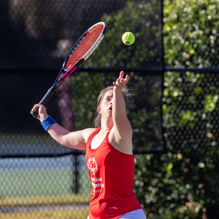 Female athlete setting up to hit the ball. 