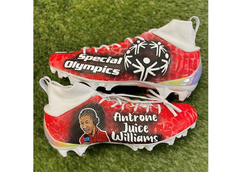 Baker Mayfield cleats, the text on the cleats reads: Special Olympics (on one side) and Antrone Juice Williams on the other side. 