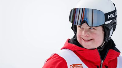 person with ski gear on in the snow