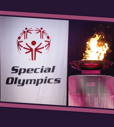 Flame of hope next to a Special Olympics banner