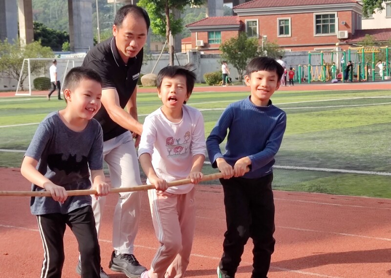 A group of athletes exercising with their coach