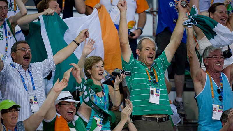 Spectators cheering in the stands. 