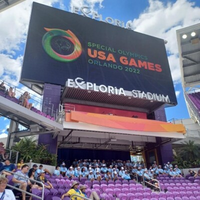 A large screen shows the Special Olympics USA Games logo. 