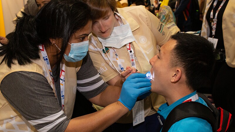 World Games Abu Dhabi 2019: athlete receiving an oral exam at a Healthy Athletes Special Smiles exam. 