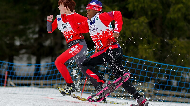 Two snowshoe athletes racing. 