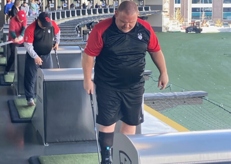 Athletes playing topgolf. 