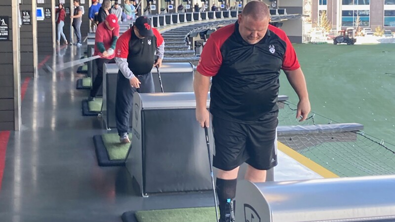 Athletes playing topgolf. 