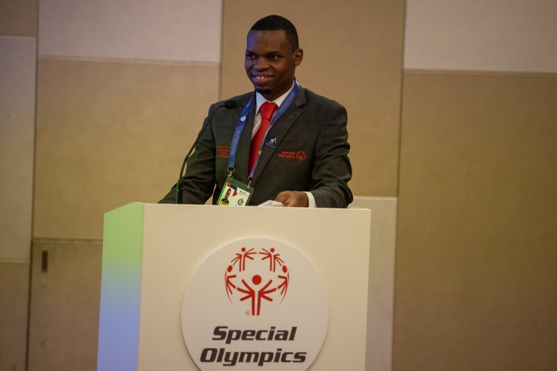 Nyasha Derera standing behind a podium.