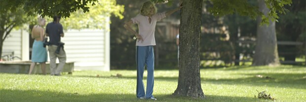 Eunice Kennedy Shriver standing by a tree