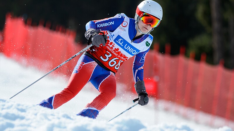 An athlete skier skiing down the hills. 