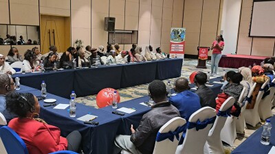 Special Olympics Ethiopia's Families & Siblings workshop: a speaker at the front of the room speaking with an audience listening. 