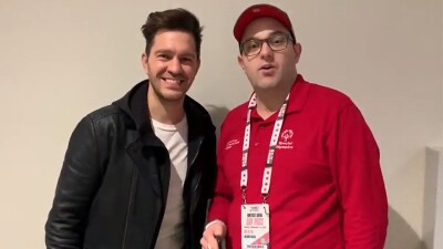 Andy Grammer and Daniel Smorowski standing side by side for a Dan's podcast interview. 