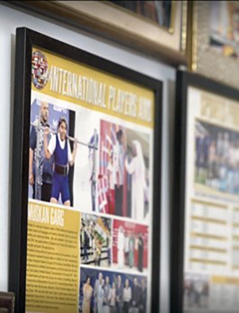 Magazine pages framed and hung on a wall. 