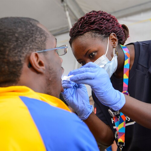 Athlete receiving an oral exam by an dental person. 