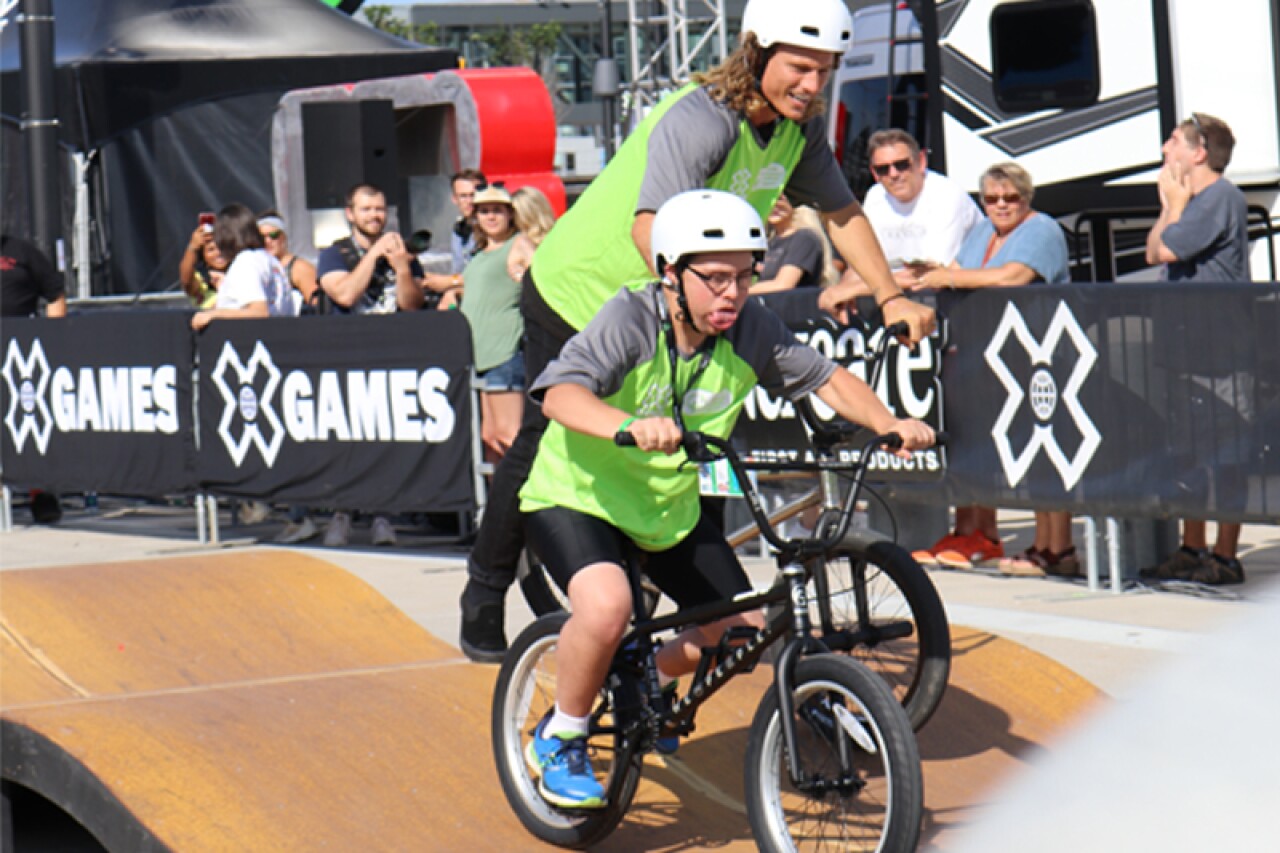 Teammates Camilo Mejia (SO Minnesota) and Dennis Enarson (10-time X Games medalist) demonstrate the power of inclusion during competition.