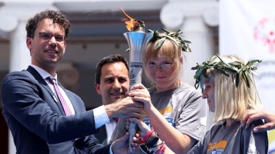 Group of people holding the flame of hope. 