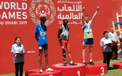 Special Olympics Bosnia and Herzegovina athlete Njegoš Mihajlović on the podium of the 400m race at the Abu Dhabi World Games 2019