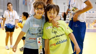 two children in colorful shirts posing for photo