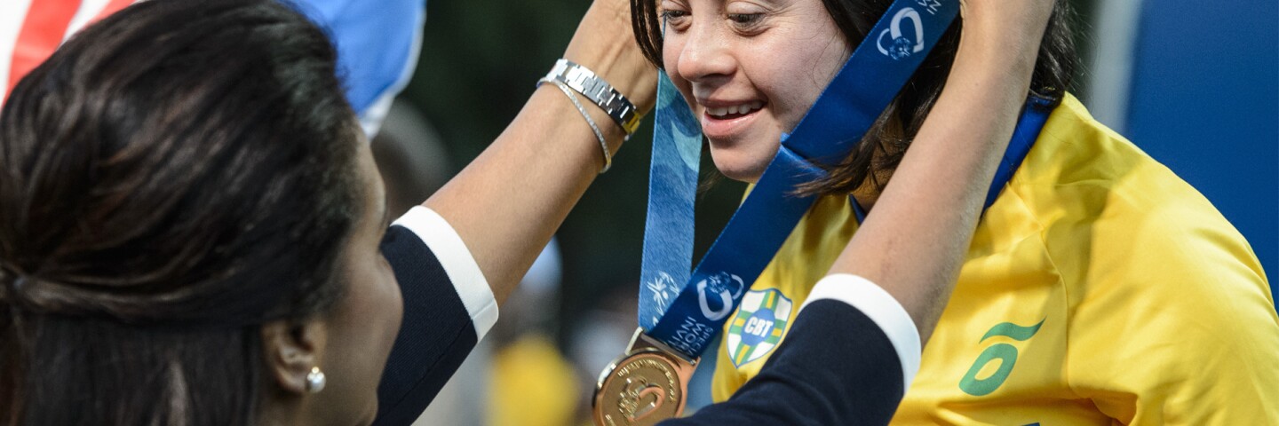 Athlete being presented a medal