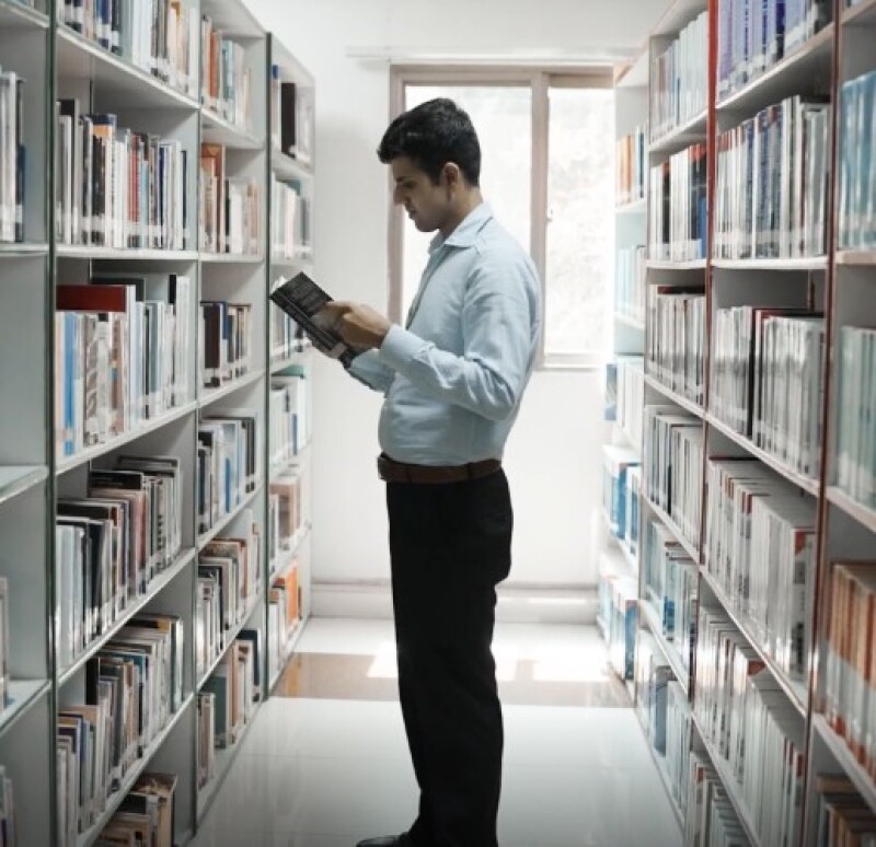 Muhammad Haseeb Abbasi in a library.