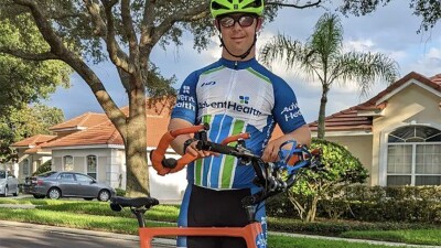 Man standing with his bike