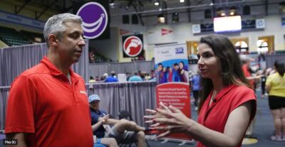 Dr. Alicia Bazzano talking to a FanSided representative at a Healthy Athletes event. 