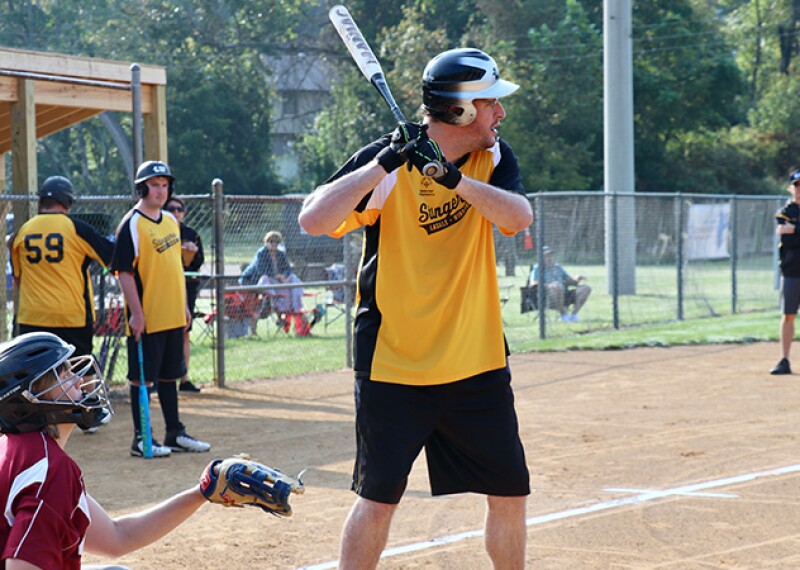 A Special Olympics softball athlete prepares to bat. 