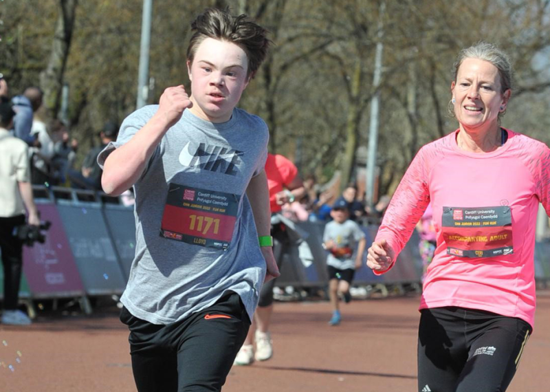 Mother and sun running in a race. 