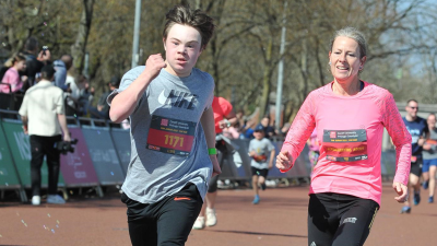 Mother and sun running in a race. 