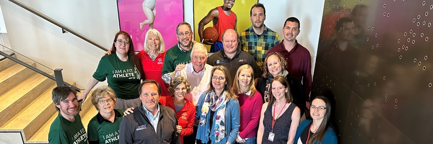 Research and Evaluation team standing on the stairs at Special Olympics International HQ in Washington DC. 