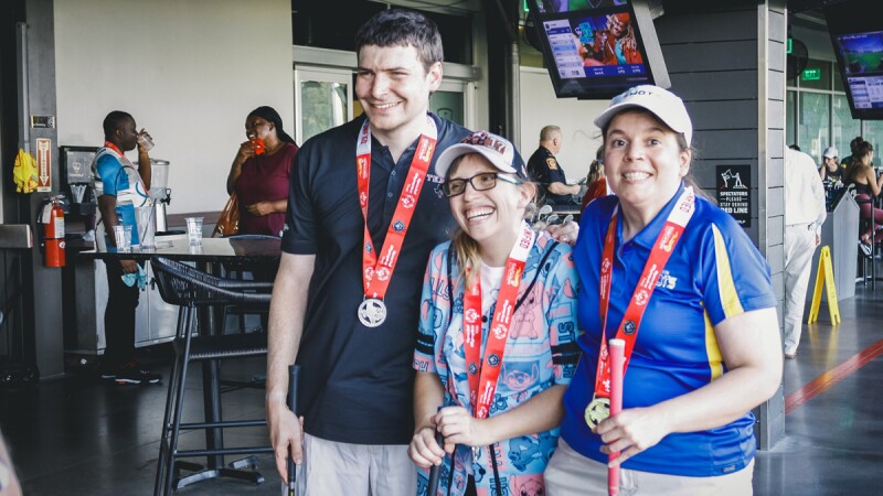 Three people standing together