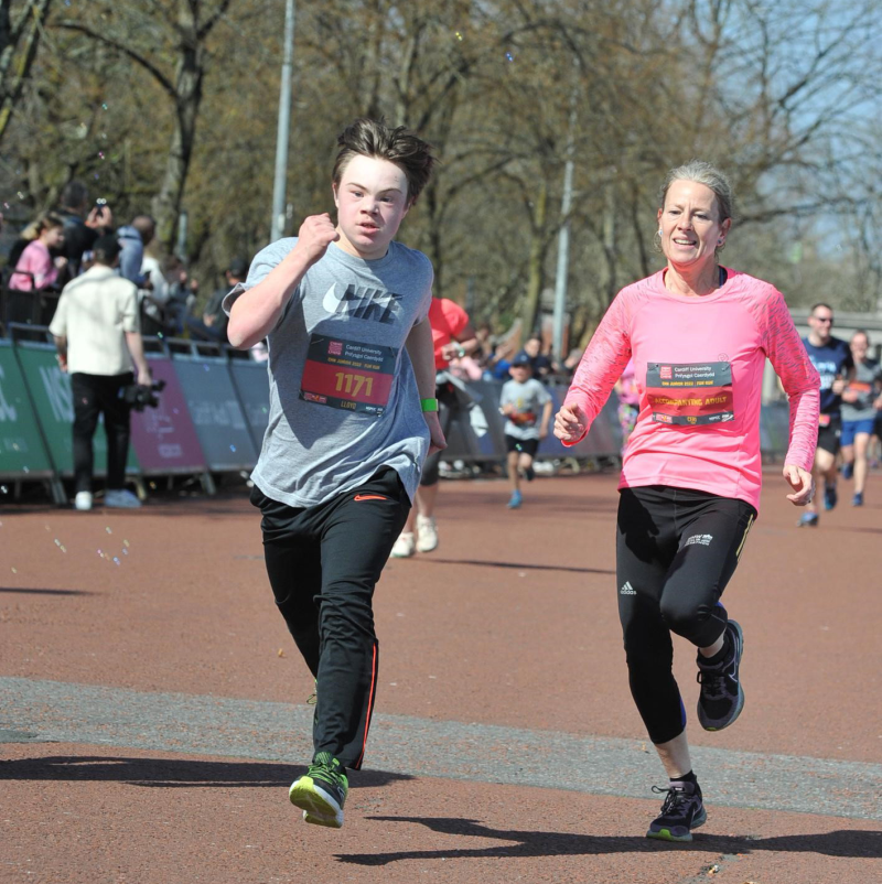 Mother and sun running in a race. 