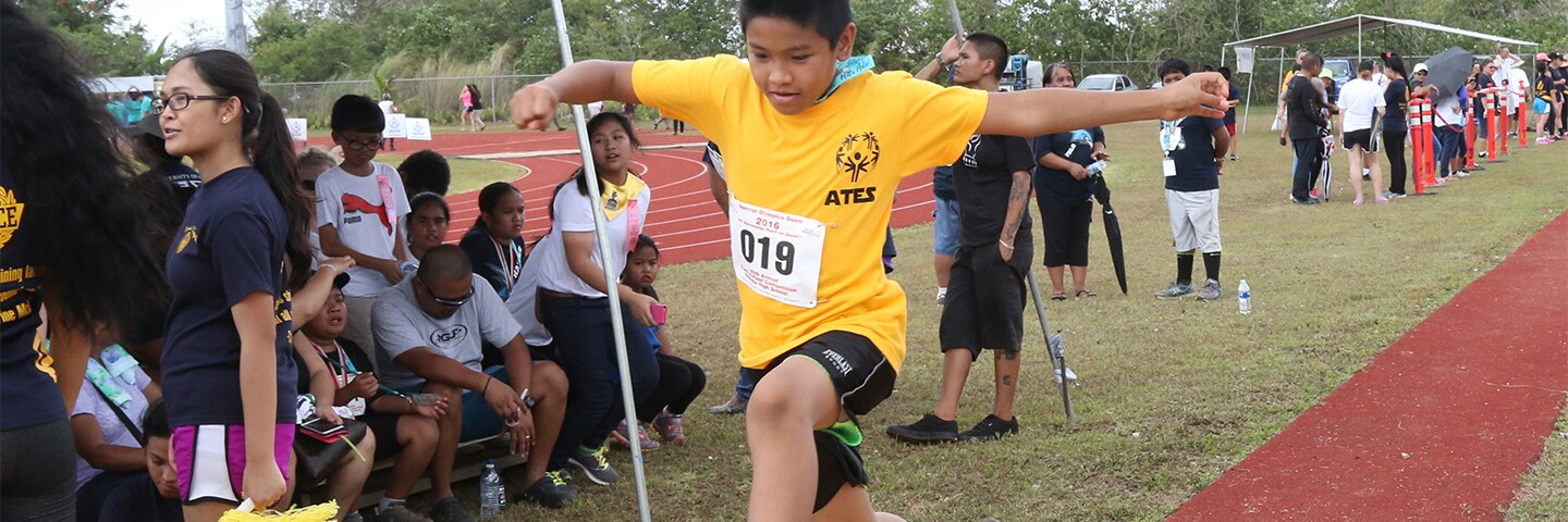 Athlete performing the long jump. 