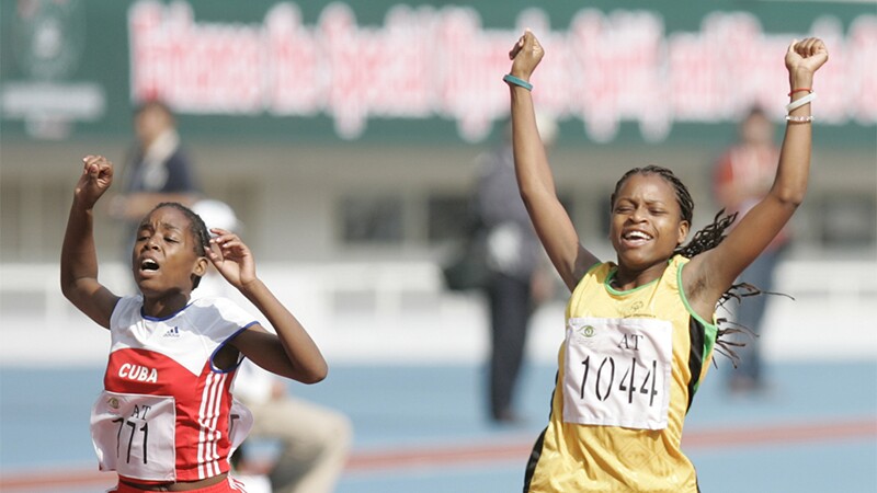 Two young women finishing a race. 