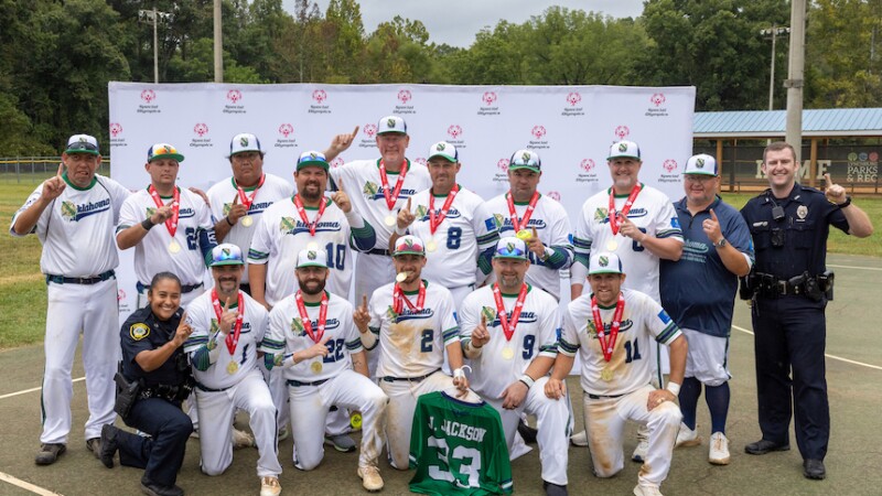 A Unified softball team poses for a photo after receiving gold medals. 