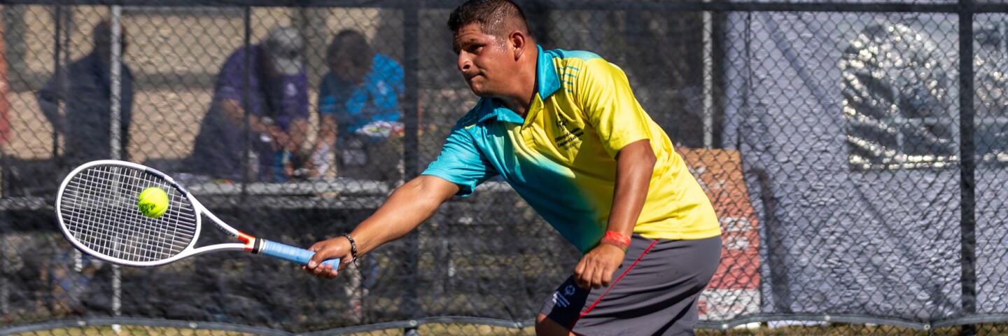 Athlete running to hit the tennis ball. 