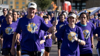 Law Enforcement Torch Runners running with the flame of hope. 