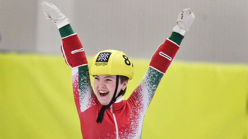 An athlete cheering. 