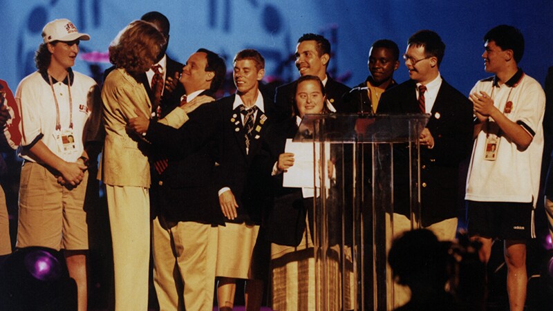 Eunice Kennedy Shriver and the Sargent Shriver International Global Messengers on stage. 